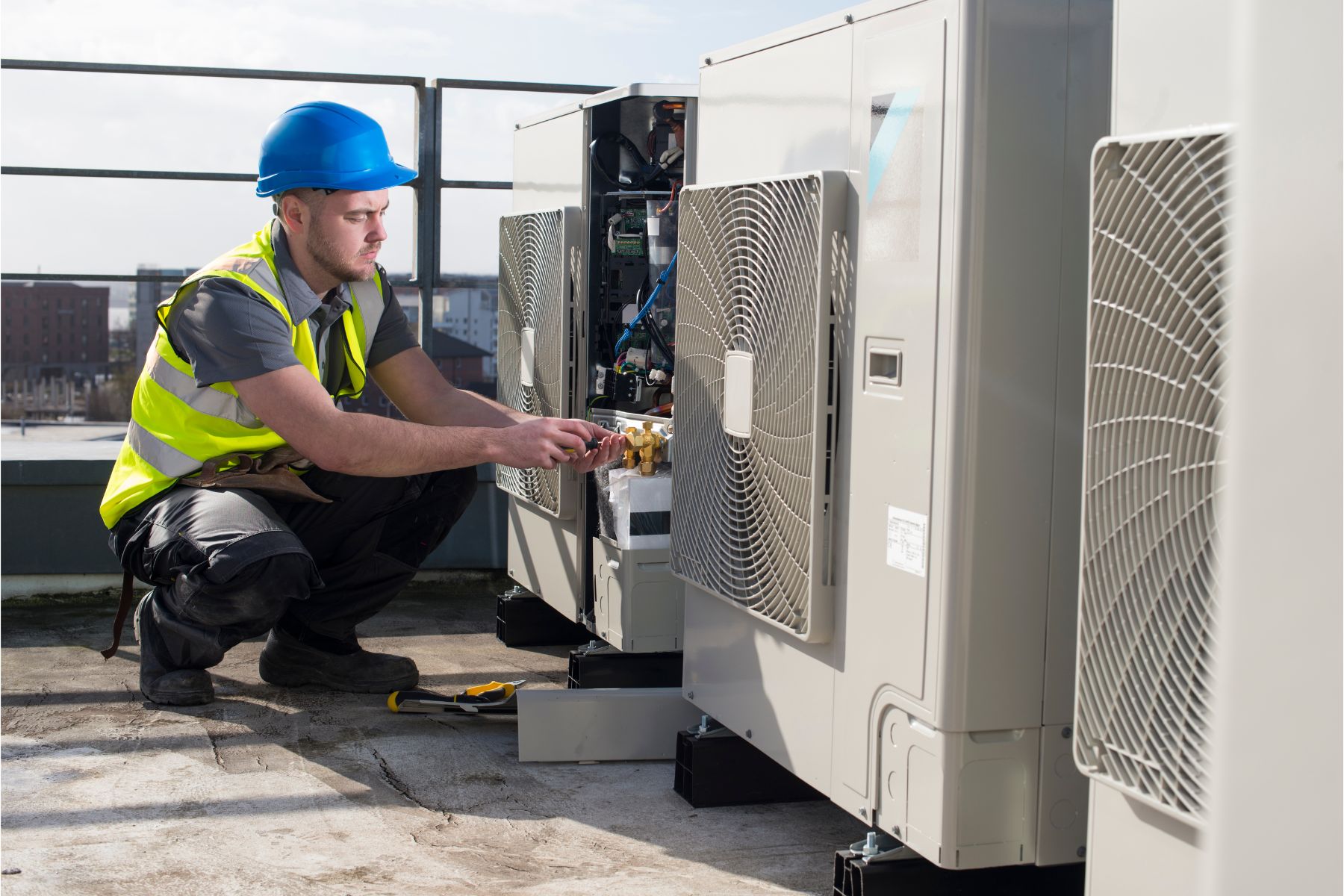 HVAC Technician repairing an outdoor unit